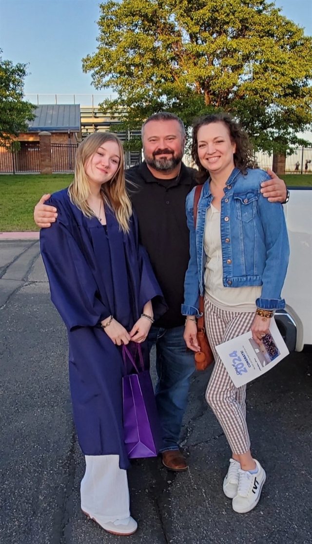Lexie pictured with her family outdoors
